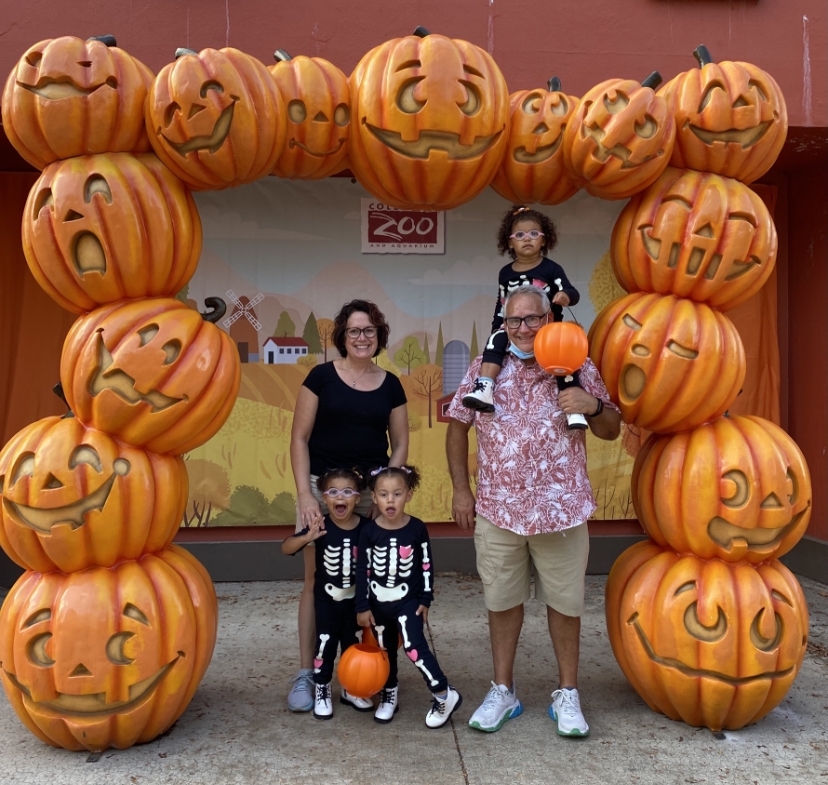 Family Picture in front of pumpkin frame at Columbus Zoo.